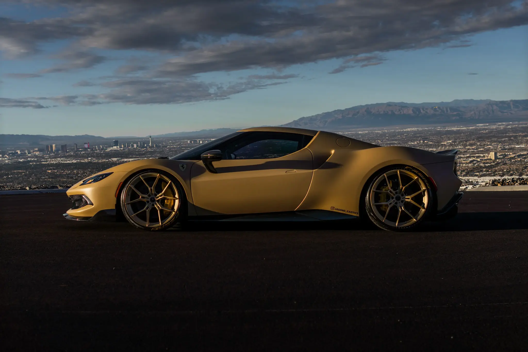 Exotic rental car above the Las Vegas skyline at dusk