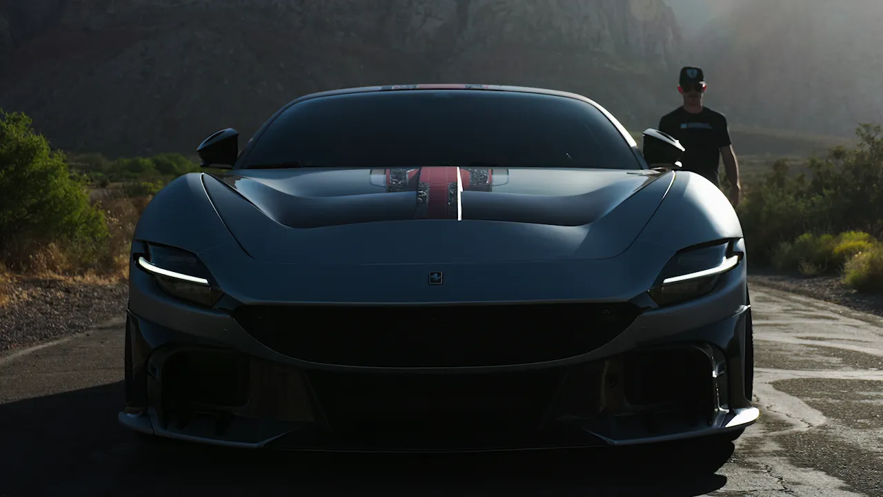 A Ferrari at dusk with its driver standing beside it