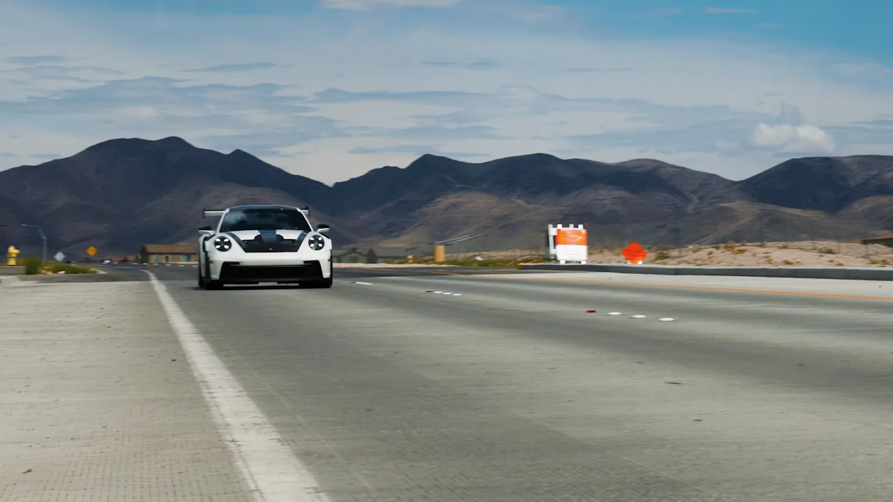 A Porsche 911 GT3 RS on an open desert highway